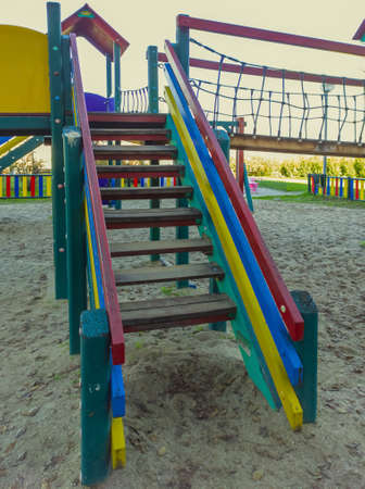 Lonely multicolored playground on a cloudy day in the cityの写真素材