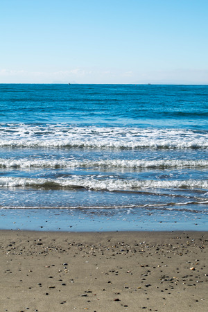 a day of peaceful waves at the beachの写真素材