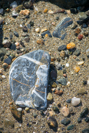 a funky stone at the beach in Marbella, Spainの写真素材