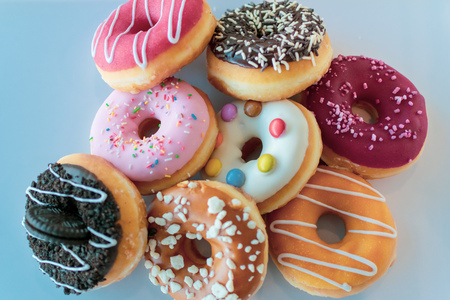 a collection of sweet tasty iced ring donutsの写真素材