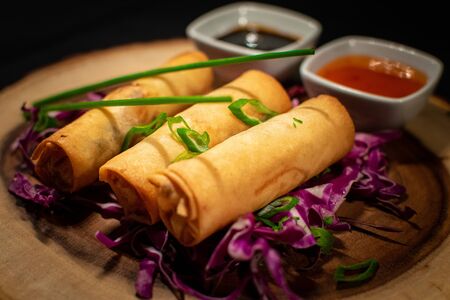 chinese spring rolls with saucesの写真素材