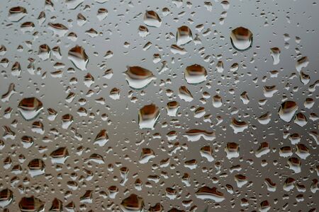 Drops of rain water on my window in Spainの写真素材