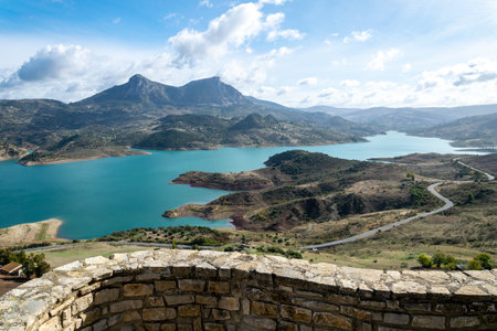from behind a winding wall, the valleys of Zahara de la sierraの写真素材