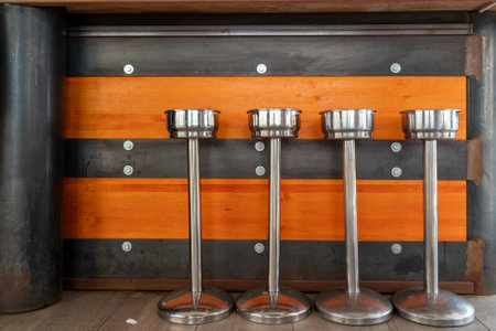 an abstract image of standing coolers lined up at a bar