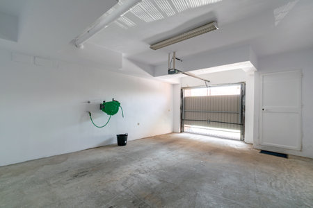 a large indoor private garage space in luxury mediterranean apartmentの写真素材