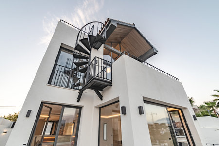 an image of a newly refurbished Mediterranean villa real estate during sunset in Marbellaの写真素材