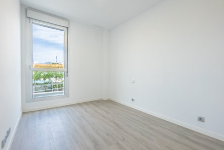 An empty room with mountain view from the window in mediterranean holiday homeの写真素材