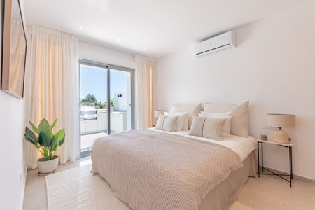 an image of a mediterranean bedroom with private balcony in holiday apartmentの写真素材