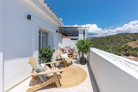 an image of a luxury balcony terrace with green hill view in mediterranean holiday apartmentの写真素材