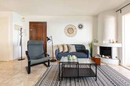 an image of a mediterranean living room with fireplace in holiday apartmentの写真素材