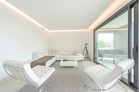 an image of various leather chairs and sofa in luxury mediterranean apartmentの写真素材