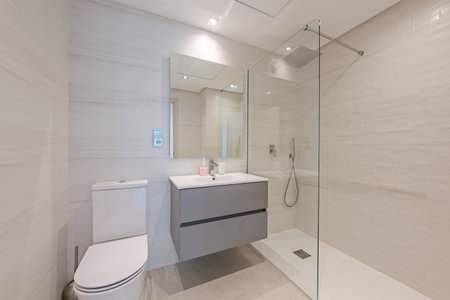 an image of a small guest bathroom with standing shower in mediterranean holiday homeの写真素材