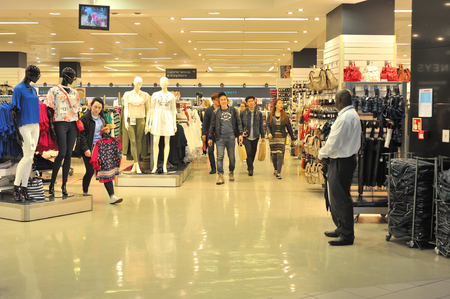 Galway City Center , Ireland June 2017,Eyre Square Centre, Penneys Entrance, group of people coming out after shopingのeditorial素材