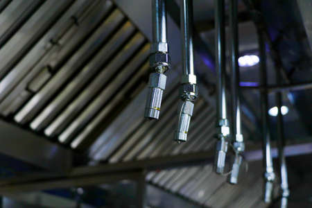 fire and safety equipment, emergency water dispenser sprinkler under the roof hood usually fixed in kitchen, factories and warehouses to prevent the fire accidentの写真素材