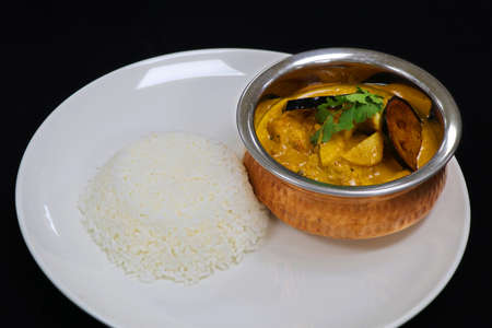 thai yellow chicken curry with jasmine riceの写真素材