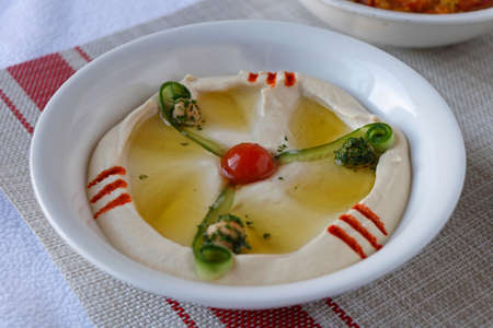 arabic food hummus dip in a bowlの写真素材
