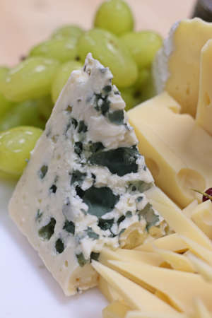 assorted cheese platter in a buffet displayの写真素材