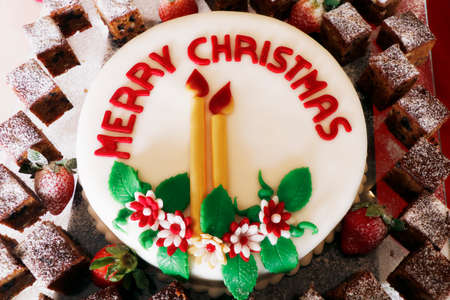 christmas festive decorated icing cake (plum cake) in close upの写真素材