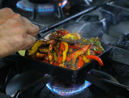 mexican chicken fajitas on sizzling plateの写真素材