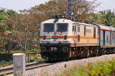 Kochi, Kerala, India -March 5, 2021 a train moving with electric support through the indian railway trackのeditorial素材