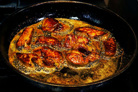 duck or goose liver known as foie gras cooking in a hot pan, luxury french delicacy food