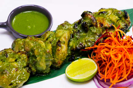 hariyali murgh tikka. mint, spinach and yoghurt marinated spiced tandoori chicken, indian cuisine
