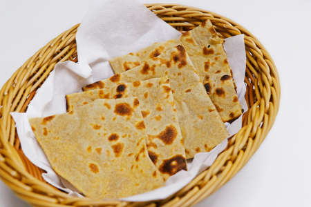 tandoori naan bread or roti in a basket, indian clay oven baked breadの写真素材