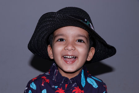adorable young handsome kid ( baby boy ) in hawaiian dress costume