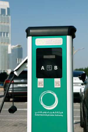 Dubai, United Arab Emirates - January 10, 2023 electric car charging station in a public parking provided by dubai water and electricity authorityのeditorial素材