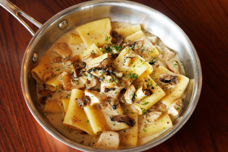 traditional italian creamy wild mushroom pasta with truffle, ceps and porchinの写真素材