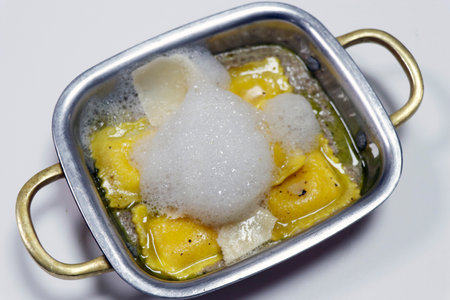three cheese stuffed ravioli with mushroom pureeの写真素材