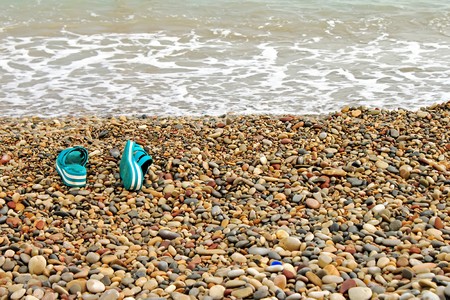 Slippers in the beachの写真素材