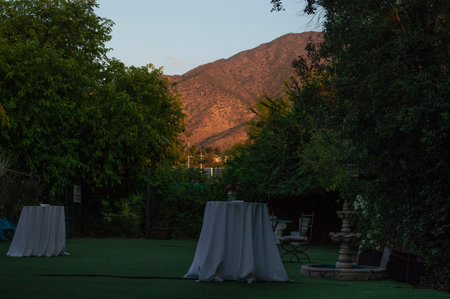 golf course with green grass and white tablecloth in the eveningの写真素材