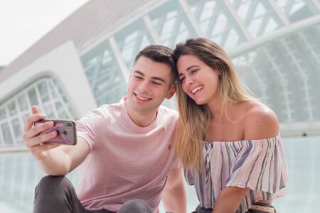 Young couple in love making a selfieの写真素材