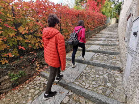Two people enjoying active tourism. Colored staircases