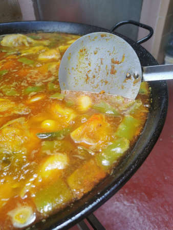 Preparation of a paella. Traditional food from the Valencian community of Spain.の写真素材