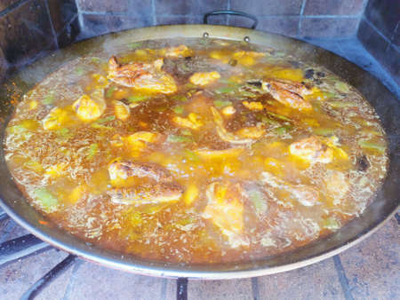 Preparation of a paella. Traditional food from the Valencian community of Spain.の写真素材
