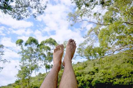 Feet up to the sky on vacationの写真素材