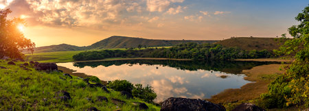 Panoramic view of the lake in the evening at sunset.の写真素材