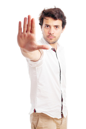 man doing stop gesture on a white backgroundの写真素材