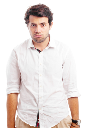 disappointed young man with arms downの写真素材