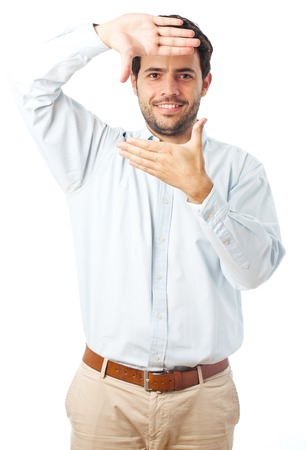 young man framing face on a white backgroundの写真素材