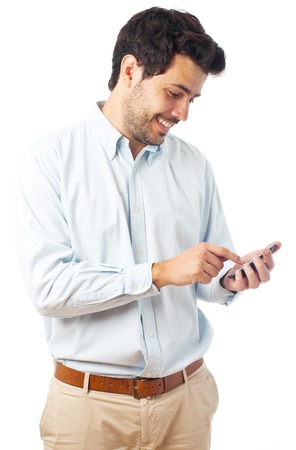 young man with an smartphone on a white backgroundの写真素材
