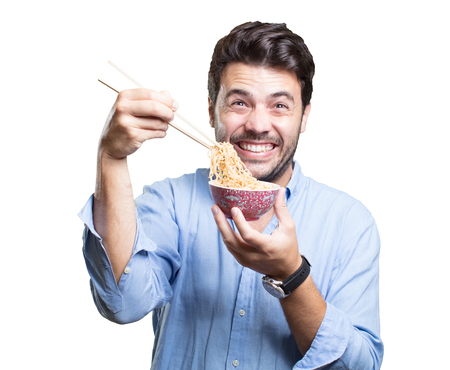 Young man eating sushi on white backgroundの写真素材