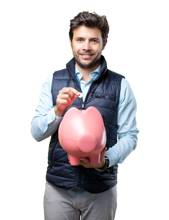 Man with vest insert coin on pigの写真素材