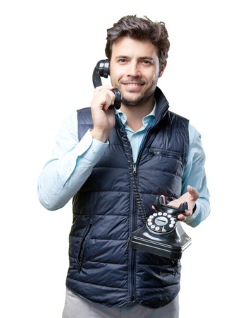 Man with vest speaking on telephoneの写真素材