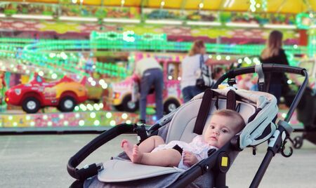 Baby having fun on a theme park
