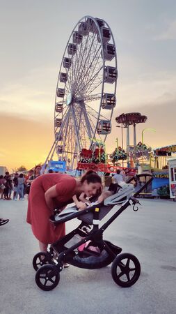 Baby having fun on a theme park