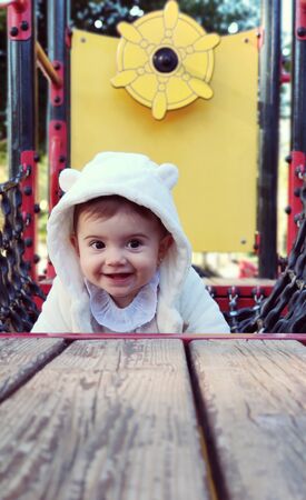 Baby having fun on a theme parkの写真素材
