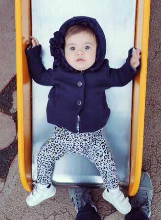 Baby having fun on a theme park
